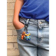Load image into Gallery viewer, Dog Man Character Backpack Clip by Geddes
